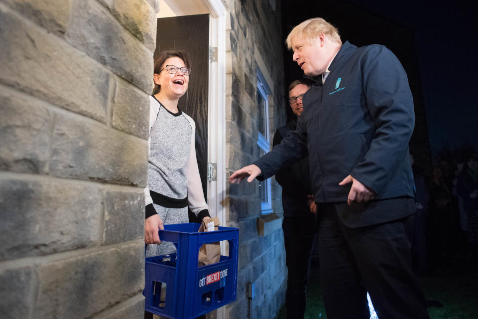 Prime Minister Boris Johnson delivers milk to Debbie Monaghan in Guiseley, Leeds, ahead of Thursday's General Election.