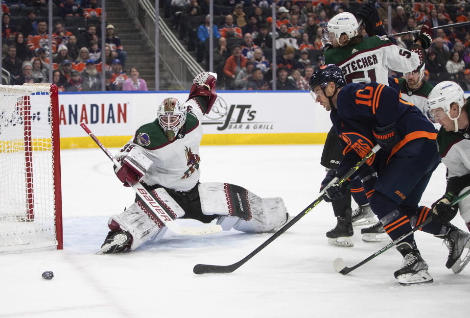 Arizona Coyotes goalie Connor Ingram (39) makes the save on Edmonton Oilers' Derek Ryan (10) during the second period of an NHL hockey game Wednesday, Dec. 7, 2022, in Edmonton, Alberta. (Jason Franson/The Canadian Press via AP)