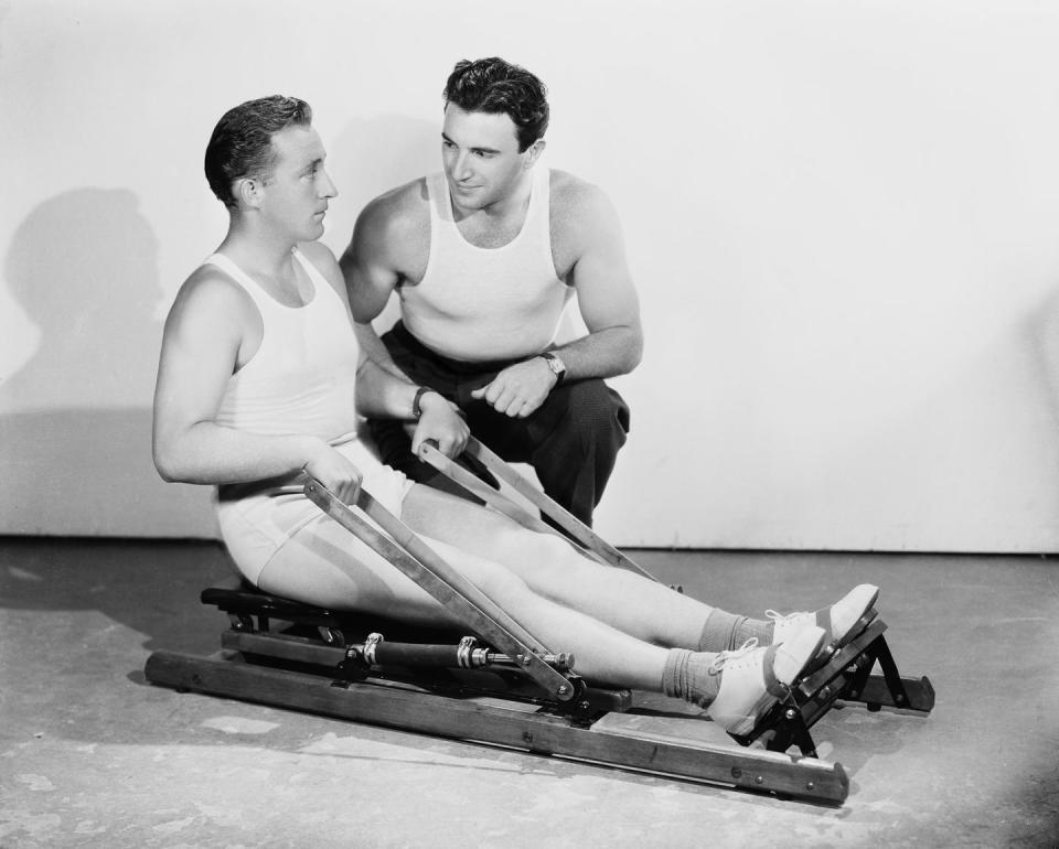 <p>Bing Crosby receives instruction on how to properly use an exercise machine at a fitness center in 1934. </p>