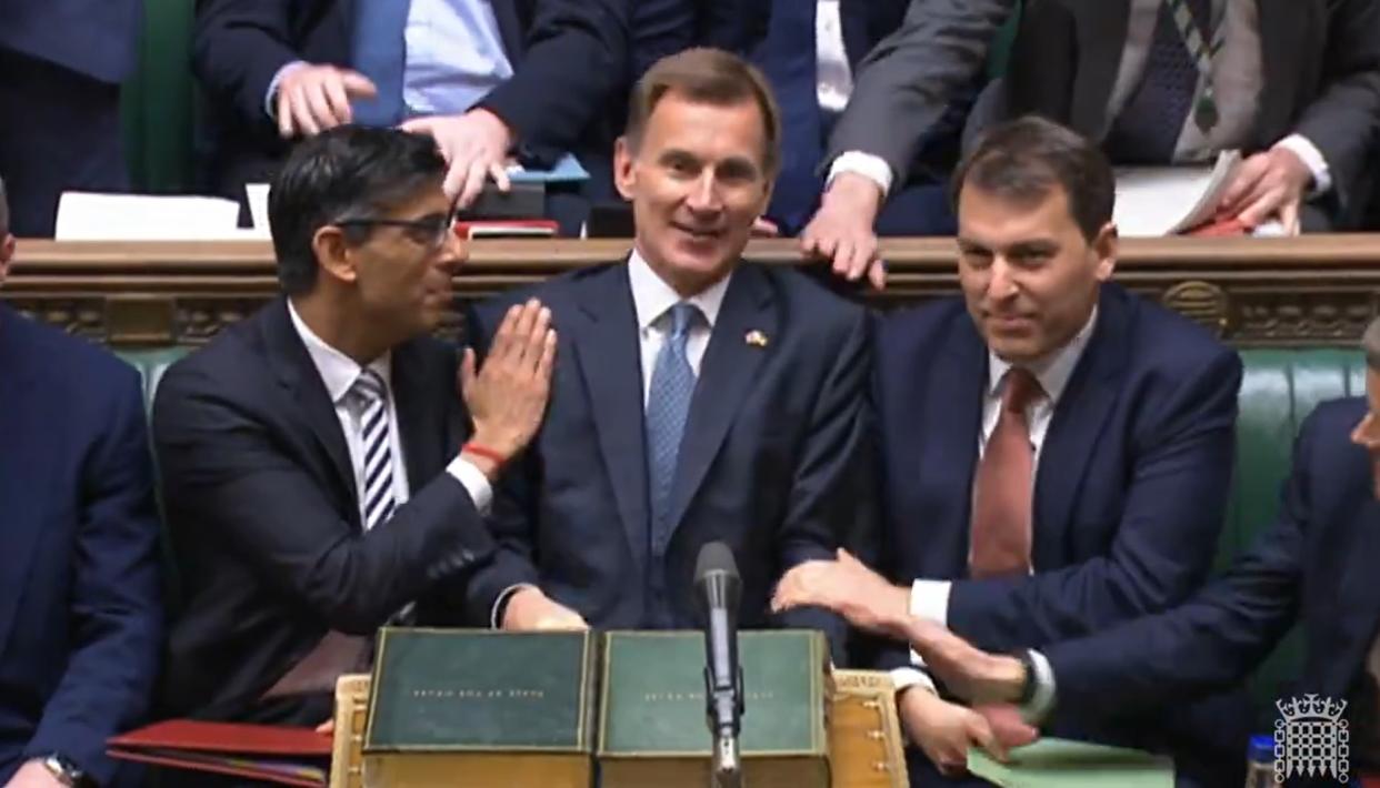 Prime Minister Rishi Sunak congratulates Chancellor of the Exchequer Jeremy Hunt after he delivered his autumn statement to MPs in the House of Commons, London. Picture date: Thursday November 17, 2022. (Photo by House of Commons/PA Images via Getty Images)