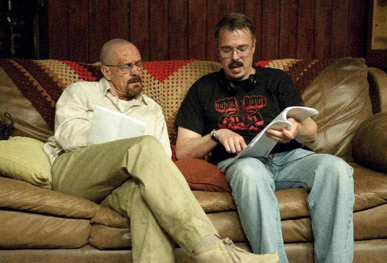 This image released by AMC shows Bryan Cranston who plays Walter White talking with series creator Vince Gilligan on the set of "Breaking Bad." The series finale aired Sunday, Sept. 29. (AP Photo/AMC, Ursula Coyote)