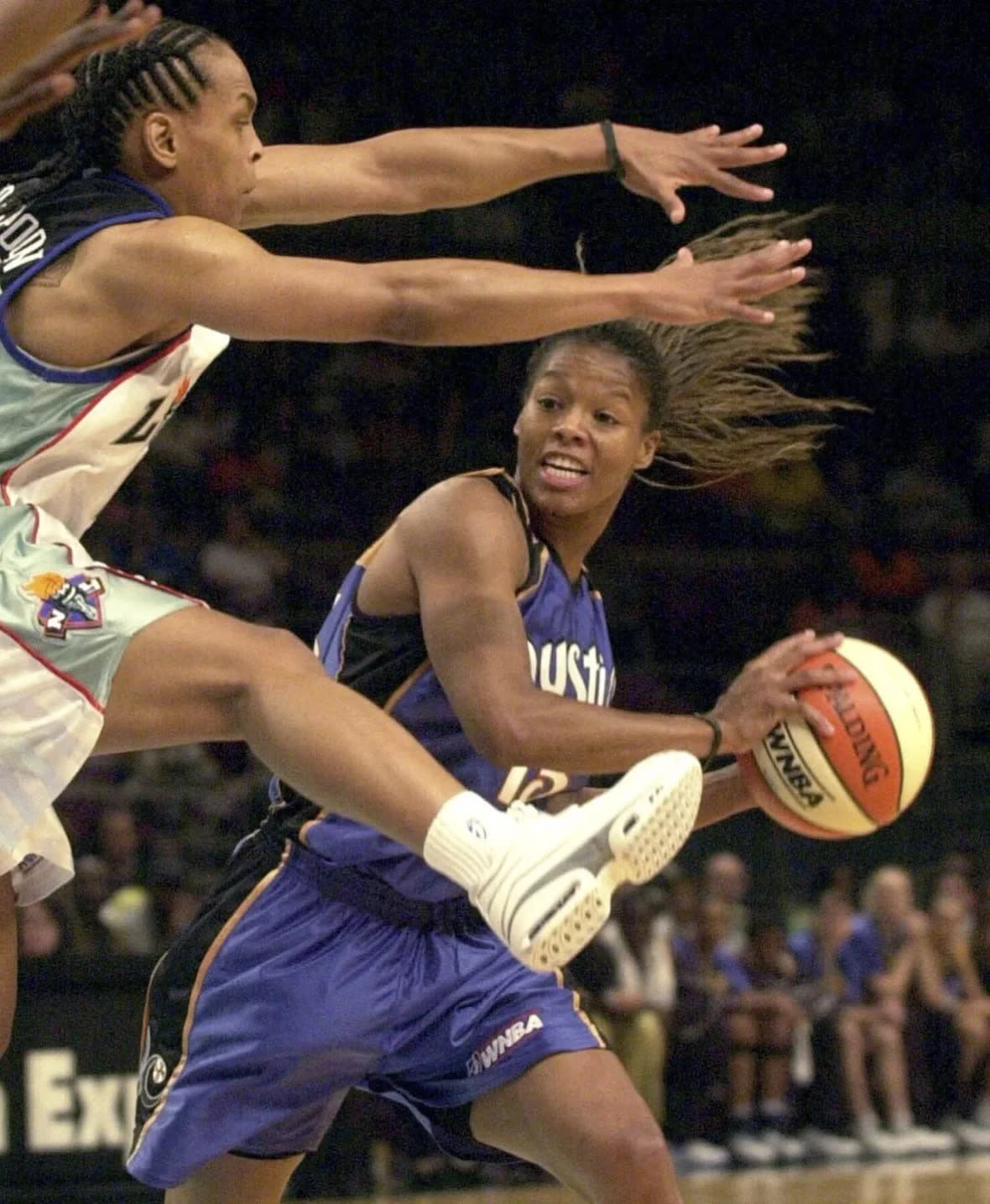 Washington Mystics’ Nikki McCray, right, is defended by New York Liberty’s Teresa Weatherspoon during the first half Saturday, June 16, 2001 in New York. (AP Photo/Mark Lennihan, File)