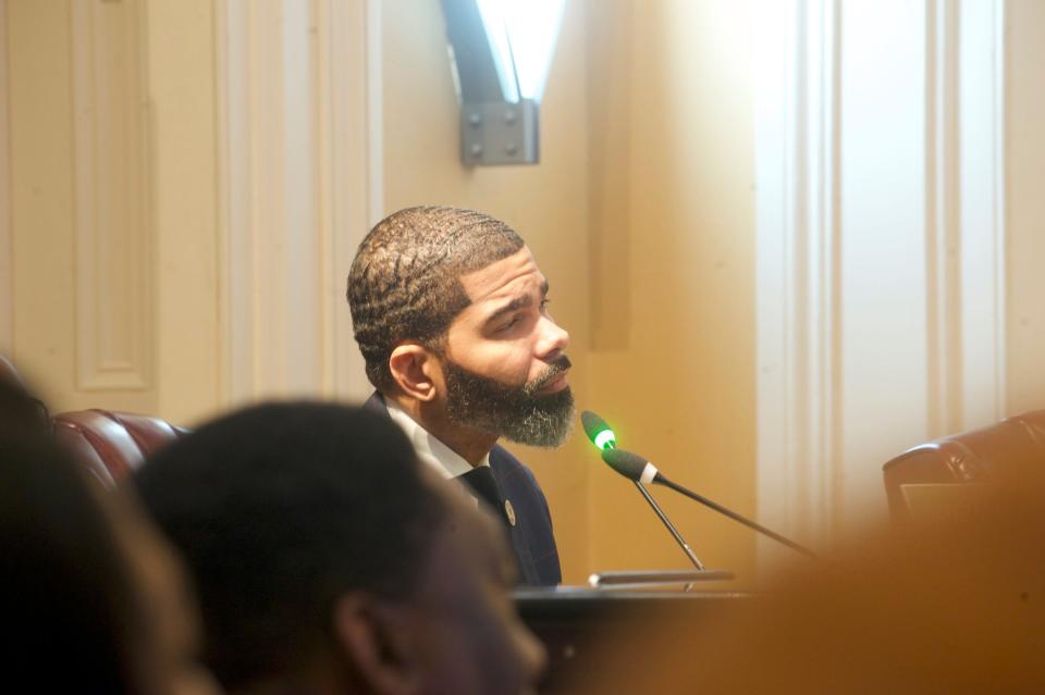 Jackson Mayor Chokwe Antar Lumumba listens to Ward 5 Councilman Vernon Hartley's concerns about the city's latest project that would build a 60-unit tiny home village for the city's homeless.