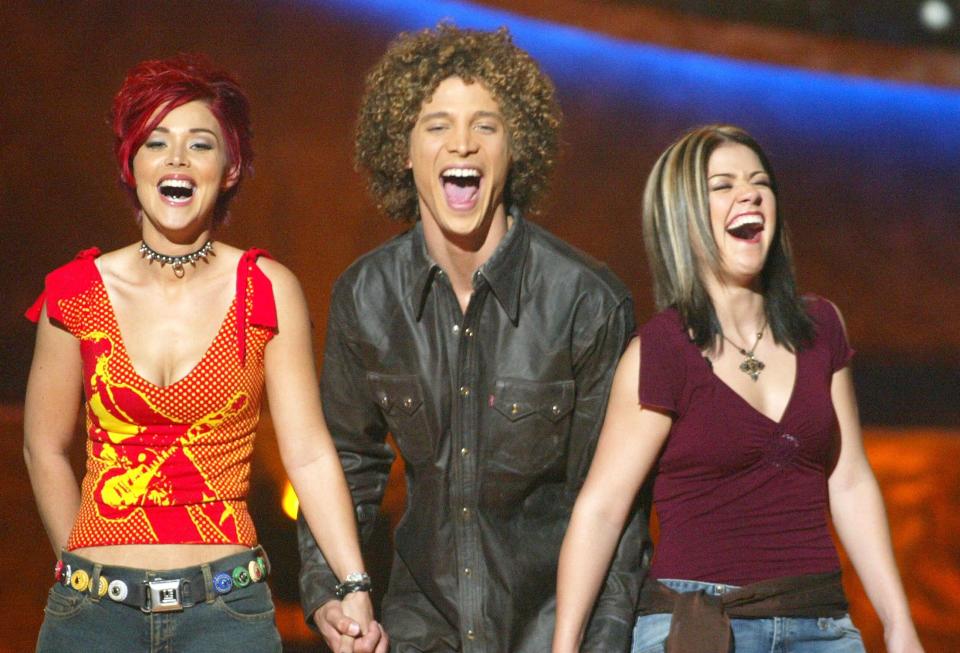 Nikki McKibbin (from left), Justin Guarini and Kelly Clarkson on "American Idol" in 2002. (Photo: Kevin Winter via Getty Images)