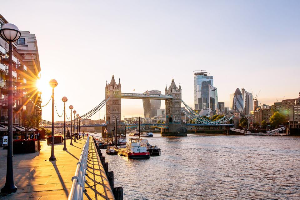 London skyline with Tower Bridge and skyscrapers of London City at sunset, England, UK