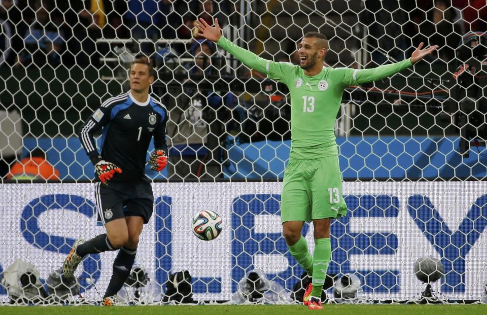 Algeria's Islam Slimani (R) reacts after his goal against Germany was disallowed during their 2014 World Cup round of 16 game at the Beira Rio stadium in Porto Alegre June 30, 2014. REUTERS/Edgard Garrido