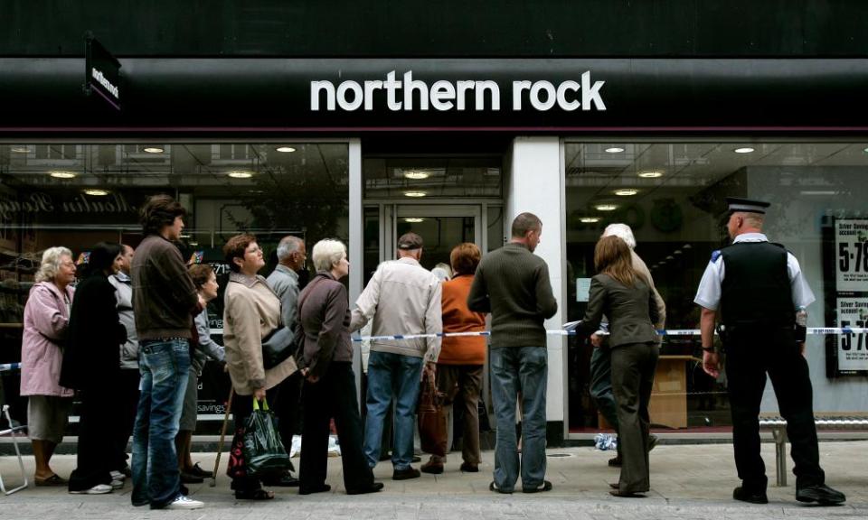 Customers queuing outside a branch of Northern Rock in September 2007. 