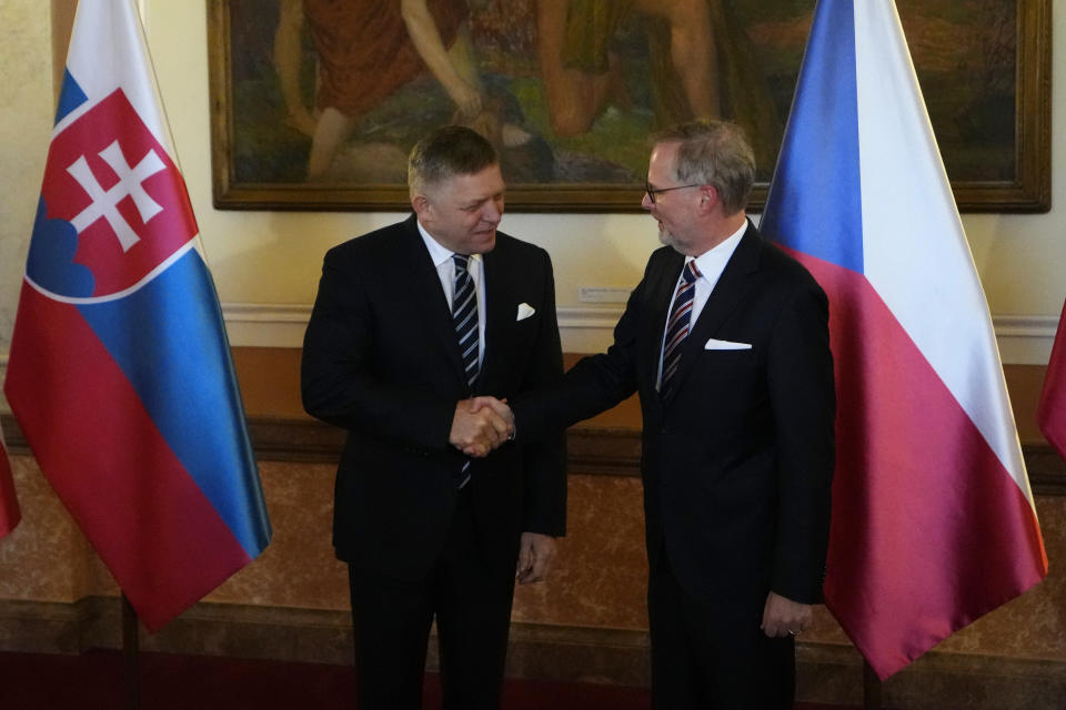 Czech Republic's Prime Minister Petr Fiala, right, welcomes his Slovakia's counterpart Robert Fico in Prague, Czech Republic, Friday, Nov. 24, 2023. (AP Photo/Petr David Josek)