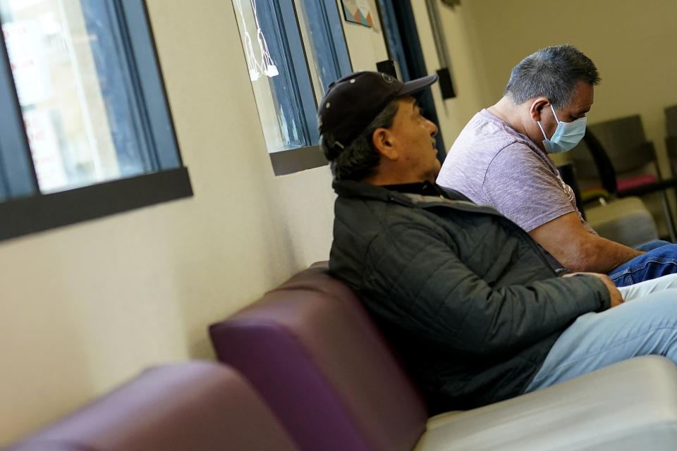 Patients waits to be seen at the Mountain Park Health Center, Thursday, March 30, 2023, in Phoenix. As heat waves fueled by climate change arrive earlier, grow more intense and last longer, people over 60 who are more vulnerable to high temperatures are increasingly at risk of dying from heat-related causes. Heat related deaths are challenging community health systems, utility companies, apartment managers and local governments to better protect older people when temperatures soar.(AP Photo/Matt York)