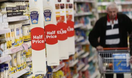 A shopper pushes a trolley in a supermarket in London, Britain April 11, 2017. REUTERS/Neil Hall