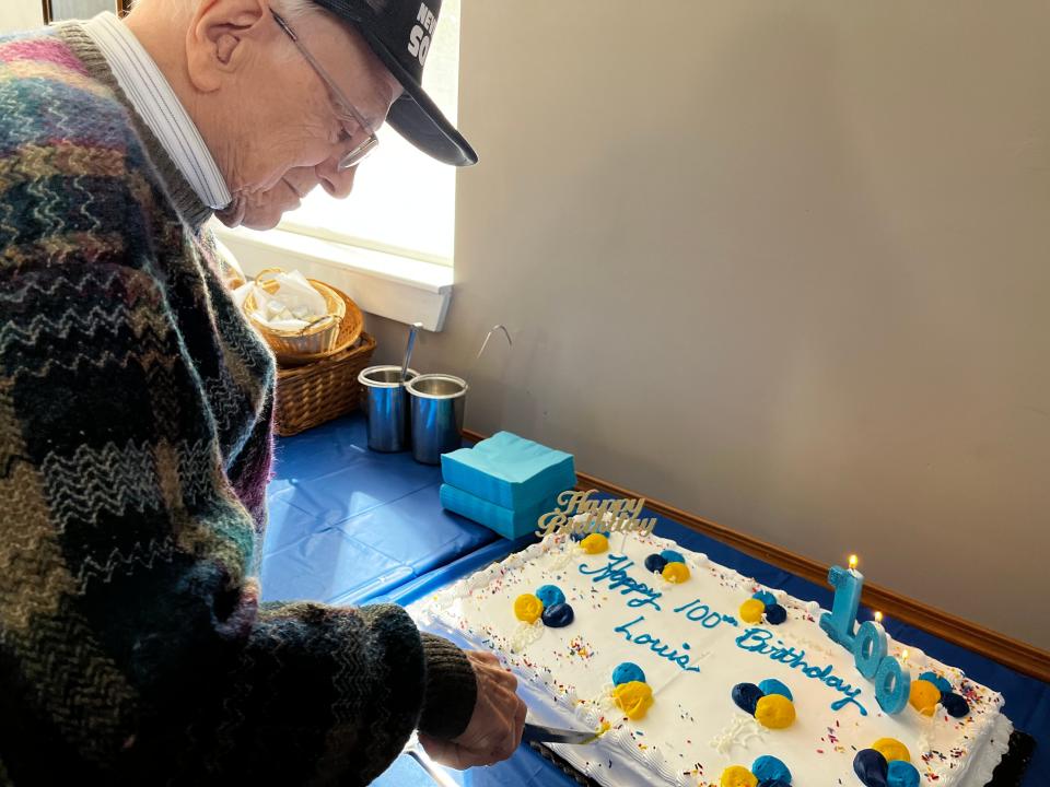 Loius Giarusso cuts the cake at his 100th birthday celebration. Perhaps 75 friends and family attended the surprise party held at the Knights of Columbus Hall in Cranston on May 7th. “I was totally surprised,” said Louis. “My niece said she was taking me to dinner with her family.”