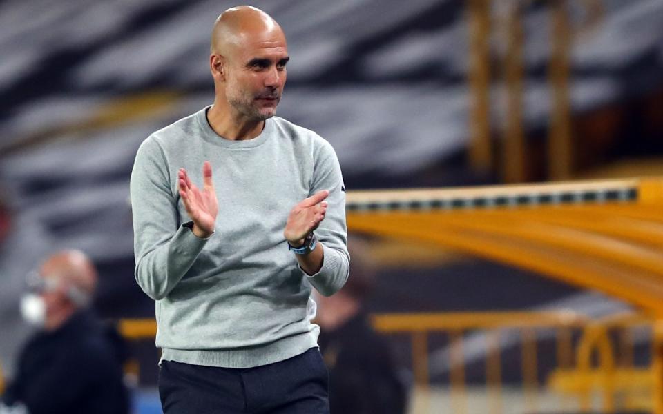 Pep Guardiola applauds his players - SHUTTERSTOCK