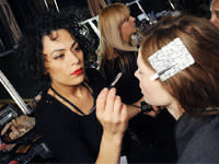 Fabiana Gomes, M.A.C.'s senior artist of Brazil, applies makeup on a model.