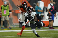 Jacksonville Jaguars' Laviska Shenault Jr. (10) makes a catch against Cincinnati Bengals' Trae Waynes (26) during the first half of an NFL football game, Thursday, Sept. 30, 2021, in Cincinnati. (AP Photo/Bryan Woolston)