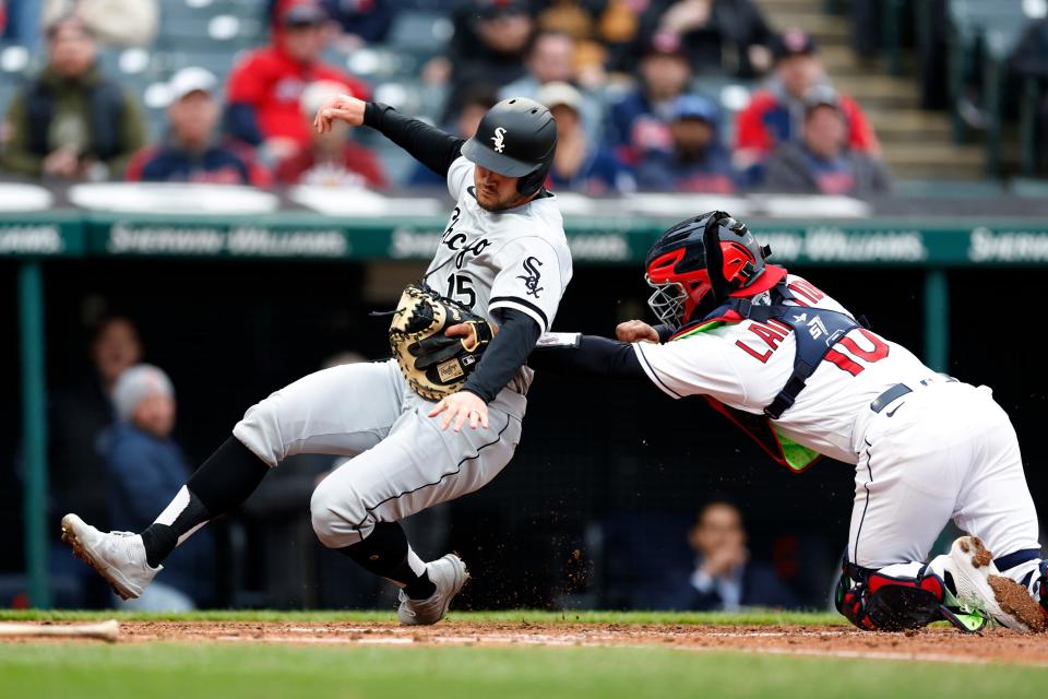 Guardians catcher Bryan Lavastida tags out White Sox runner Adam Engel at home plate during the fifth inning in the second game of a doubleheader Wednesday, April 20, 2022, in Cleveland.