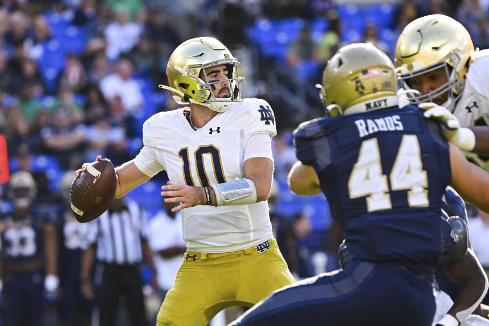 Notre Dame quarterback Drew Pyne (10) looks to pass the ball during the second half of an NCAA college football game against Navy , Saturday, Nov. 12, 2022, in Baltimore. (AP Photo/Terrance Williams)