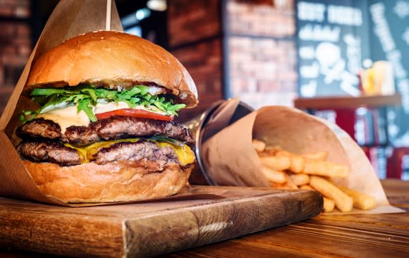 A fancy looking cheeseburger with fries