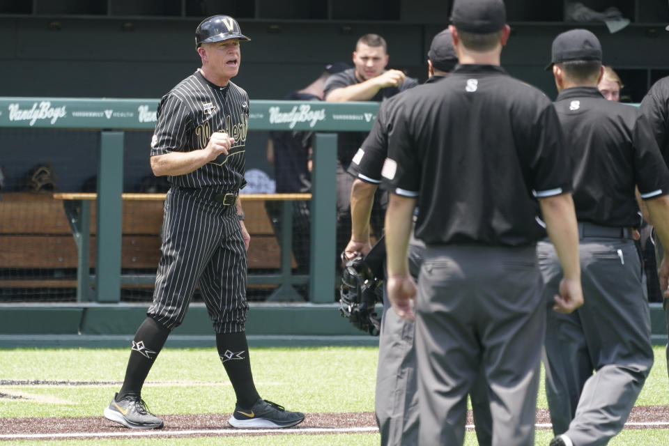 Vanderbilt head coach Tim Corbin protests a call at the plate in the eighth inning of an NCAA college baseball super regional game against East Carolina Friday, June 11, 2021, in Nashville, Tenn. The call was reversed and Vanderbilt's run counted. Vanderbilt won 2-0. (AP Photo/Mark Humphrey)