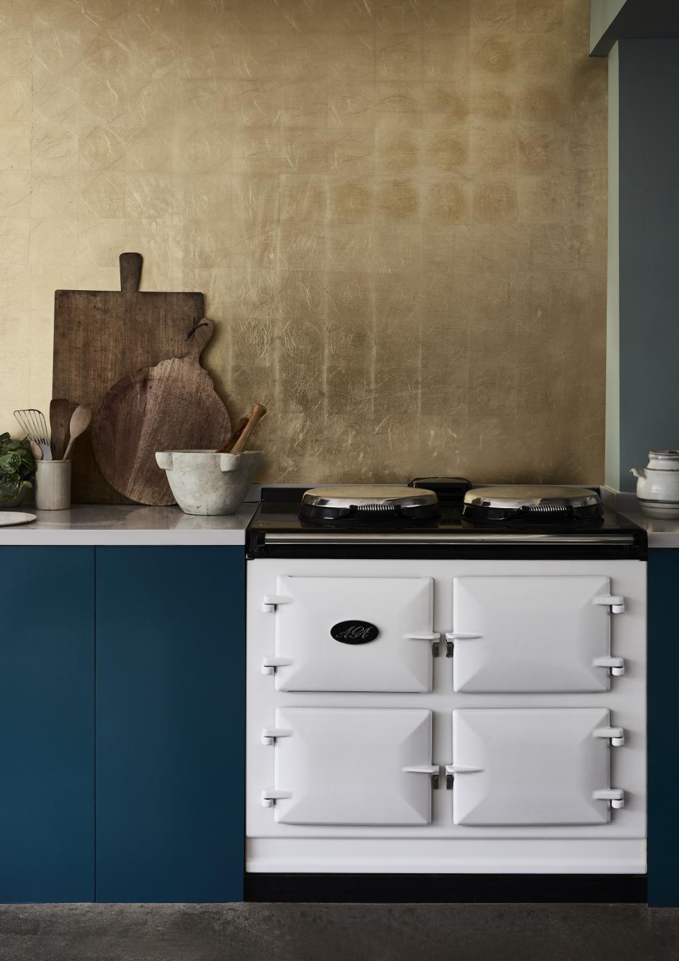 14. Add drama to a kitchen wall with a touch of gold