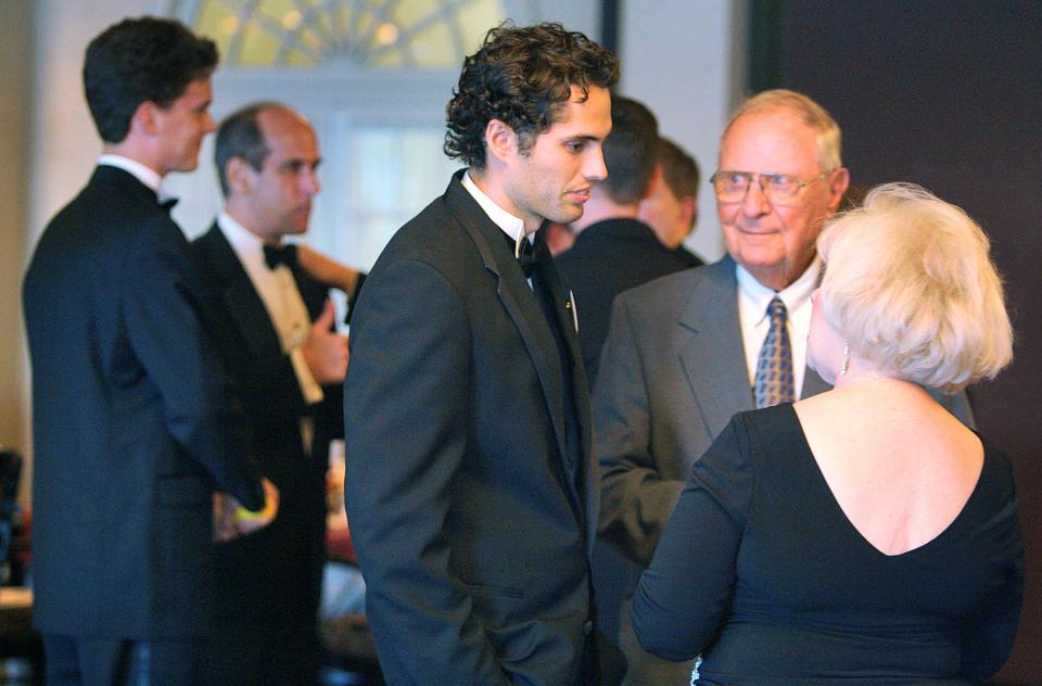 Former Lakeland City Commissioner Tom Shaw, center, talks with Craig Romney, left, son of Republican presidential hopeful Mitt Romney, and Republican National Hispanic Assembly chairperson Alci Maldonado, right, during the group's annual Presidential Black Tie Gala Saturday August 18, 2007 in Lakeland.