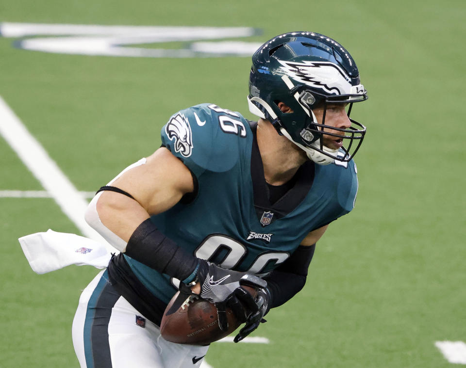 FILE - In this Dec. 27, 2020, file photo, Philadelphia Eagles tight end Zach Ertz catches a pass prior to an NFL football game in Arlington, Texas. Even during a pandemic with ticket sales limited and the off-the-field events drastically scaled back, an event like the Super Bowl also brings with it a heightened risk of human trafficking. Ertz is among a handful of NFL players who’ve joined the cause to help fight such atrocities. (AP Photo/Michael Ainsworth, File)