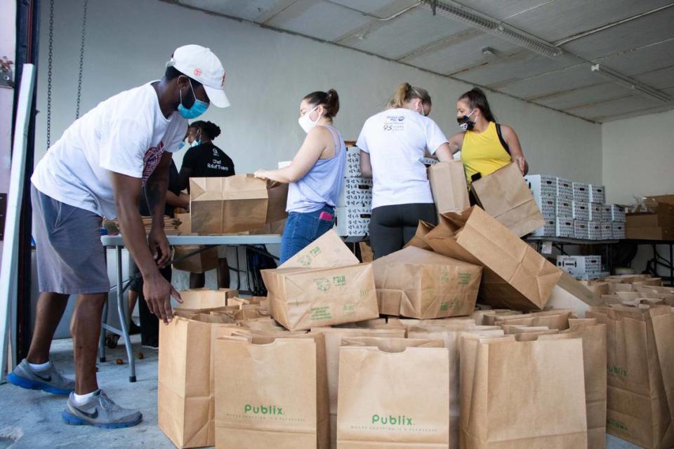 United Way of Miami-Dade volunteers pack food bags for Miami-Dade County Public Schools at Hearts of Palm Catering in Miami earlier this year.