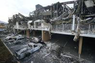 FILE - Wildfire wreckage is shown on Aug. 11, 2023, in Lahaina, Hawaii. Hawaii's top public utility officials and the president of Hawaiian Electric are expected to testify Thursday, Sept. 28, in a congressional hearing about the role the electrical grid played in last month's deadly Maui wildfire. (AP Photo/Rick Bowmer, File)