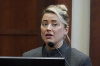 Actor Amber Heard testifies in the courtroom at the Fairfax County Circuit Courthouse in Fairfax, Va., Monday, May 16, 2022. Actor Johnny Depp sued his ex-wife Amber Heard for libel in Fairfax County Circuit Court after she wrote an op-ed piece in The Washington Post in 2018 referring to herself as a "public figure representing domestic abuse." (AP Photo/Steve Helber, Pool)