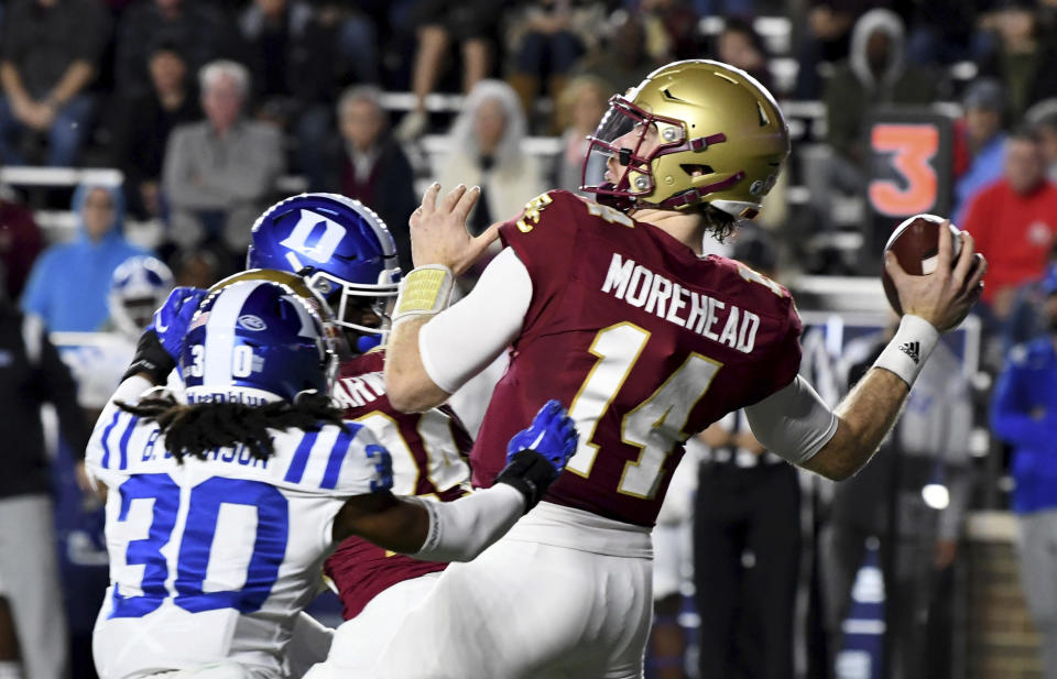 Boston College quarterback Emmett Morehead looks to throw under pressure during the first half of an NCAA college football game against Duke, Friday, Nov. 4, 2022, in Boston. (AP Photo/Mark Stockwell)