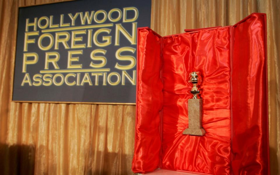 The Hollywood Foreign Press Association's Golden Globe statuette is seen with its red velvet-lined, leather-bound chest during a news conference in Beverly Hills, California - Reuters