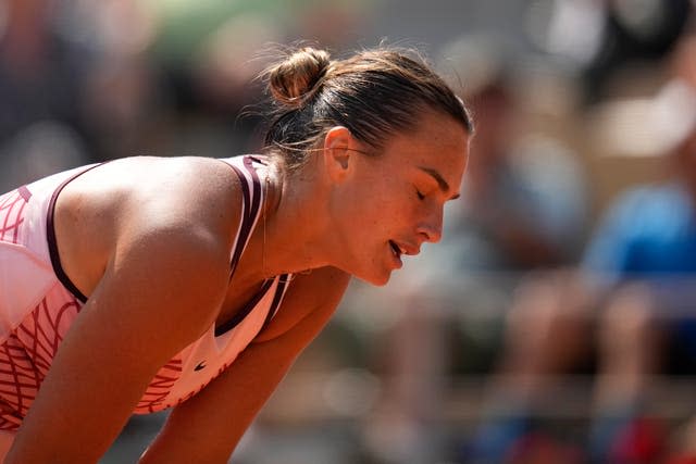 Aryna Sabalenka reacts after missing a shot 