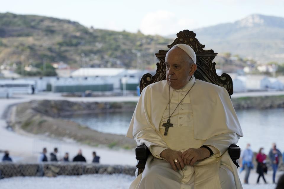 Pope Francis attends a ceremony at the Karatepe refugee camp, on the northeastern Aegean island of Lesbos, Greece, Sunday, Dec. 5, 2021. Pope Francis is returning to Lesbos, the Greek island that was at the heart of a massive wave of migration into Europe. (AP Photo/Alessandra Tarantino)