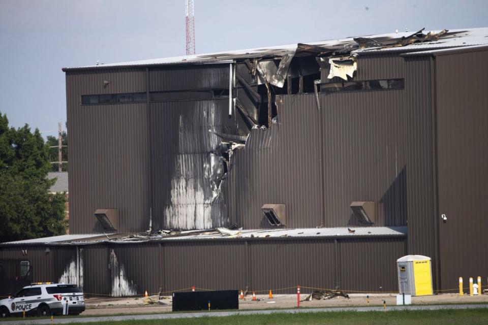 The hangar at Addison Airport in Texas was damaged by the crash (Picture: AP)