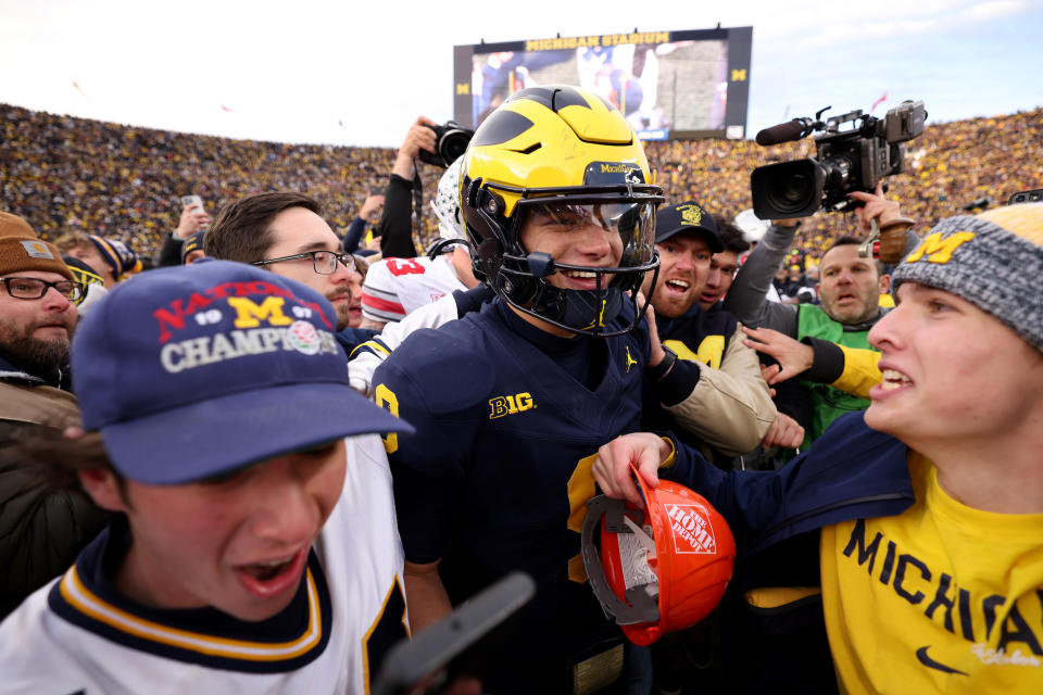 Michigan QB J.J. McCarthy celebrate with fans. (Gregory Shamus/Getty Images)