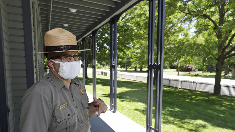 Todd Arrington, site manager for the James A. Garfield National Historic Site, talks about how Garfield would speak to the public from the front porch, Wednesday, June 3, 2020, in Mentor, Ohio. In the nation's early decades, campaigning for oneself simply wasn't done. It was seen as rude and uncivil. But three Ohio-born presidents, beginning with James Garfield in 1880, found a clever way to sidestep tradition. They stumped from their front porches. (AP Photo/Tony Dejak)