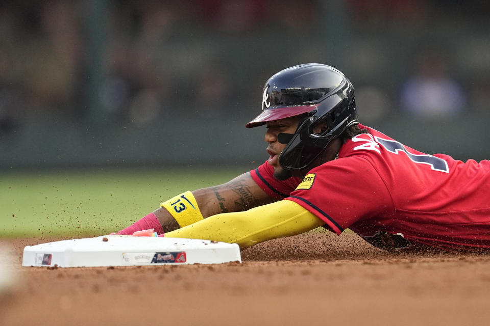 Atlanta Braves' Ronald Acuna Jr. steals second base in the first inning of a baseball game against the Colorado Rockies, Friday, June 16, 2023, in Atlanta. (AP Photo/John Bazemore)