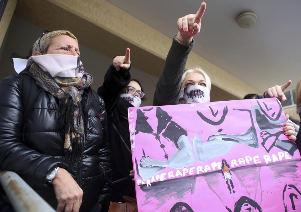 Protesters stage a demonstration outside a court house in Paralimni, Cyprus on Monday, December 30, 2019, in support of a 19 year-old British woman who was found guilty of fabricating claims that she was gang raped by 12 Israelis. Announcing his verdict, Judge Michalis Papathanasiou said the defendant didn't tell the truth and tried to deceive the court with "convenient"and "evasive" statements in court. She is due to be sentenced on Jan. 7.(AP Photo/Philippos Christou)
