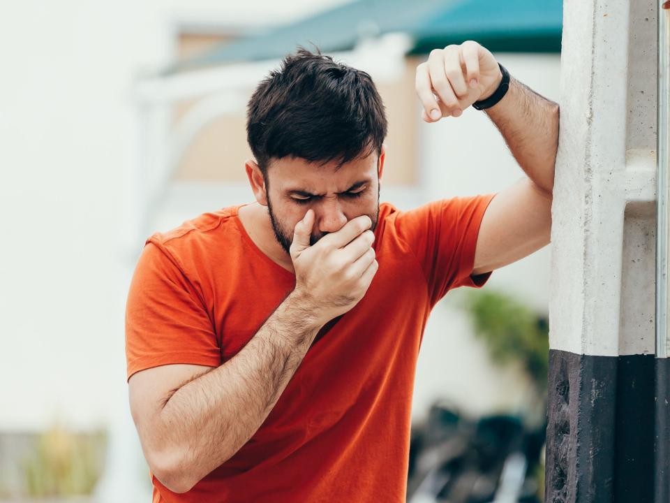 man feeling nauseous