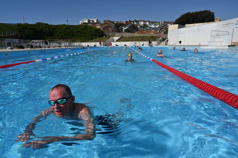 Bathers swim in Saltdean Lido near Brighton