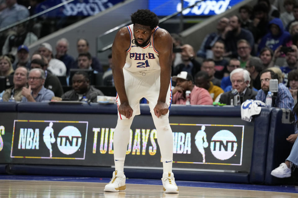 Philadelphia 76ers' Joel Embiid (21) pauses for a moment during a stoppage in play in the second half of an NBA basketball game against the Philadelphia 76ers, Thursday, March 2, 2023, in Dallas. (AP Photo/Tony Gutierrez)