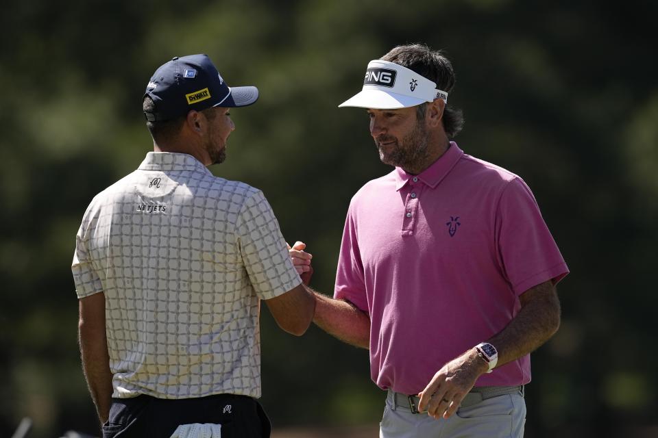 Jason Day, of Australia, and Bubba Watson, right, talk on the seventh hole during a practice round in preparation for the Masters golf tournament at Augusta National Golf Club Monday, April 8, 2024, in Augusta, Ga. (AP Photo/George Walker IV)