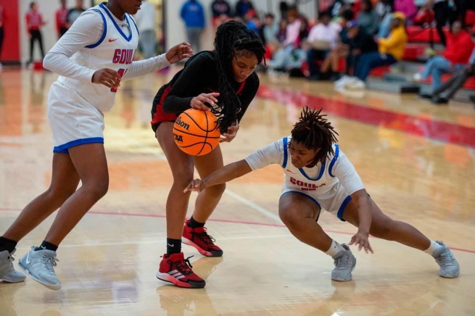 Harrison Central’s Jayla Carriere protects the ball during a game at Pascagoula High School on Tuesday, Dec. 5, 2023.