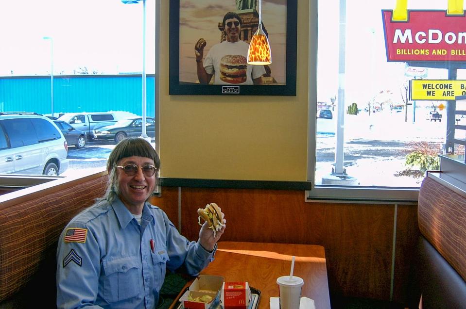 Donald Gorske eating a Big Mac inside a McDonald's