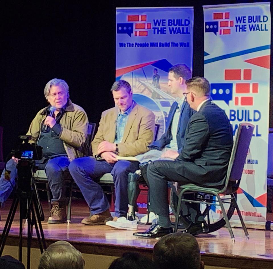 Steve Bannon (L), former adviser to President Trump, is joined by Brian Kolfage, founder of 'We Build The Wall,' and former Kansas Secretary of State Kris Koback, during a public discussion of border issues in Green Valley Friday night.