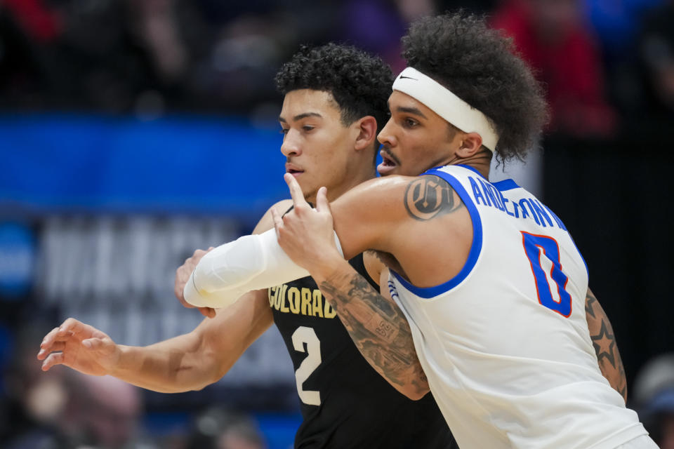 Colorado guard KJ Simpson, left, and Boise State guard Roddie Anderson III work for position during the second half of a First Four game in the NCAA men's college basketball tournament Wednesday, March 20, 2024, in Dayton, Ohio. (AP Photo/Aaron Doster)