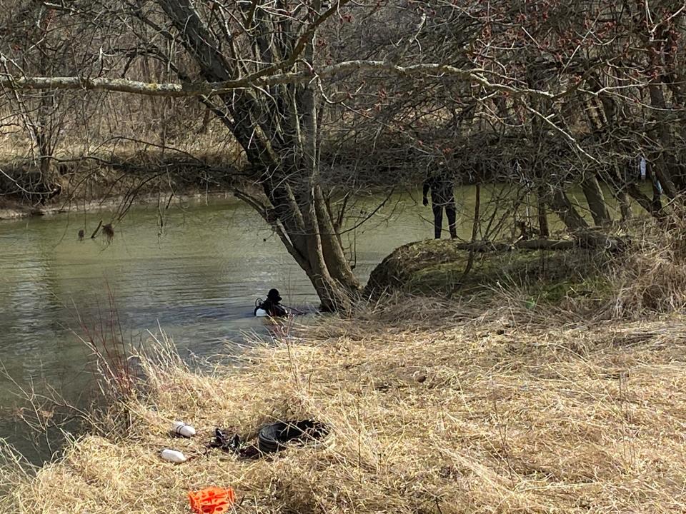 Divers from the Ashland County Sheriff's Office searched the Black Fork along Ohio 545 in Richland County for evidence related to an Ashland County homicide earlier this year.