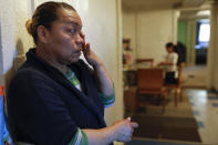 Janeth wipes away tears as she worries about how to feed her family, Wednesday, April 15, 2020, in Washington. Since this image was taken Janeth and her husband Roberto have been diagnosed with COVID-19. (AP Photo/Jacquelyn Martin)