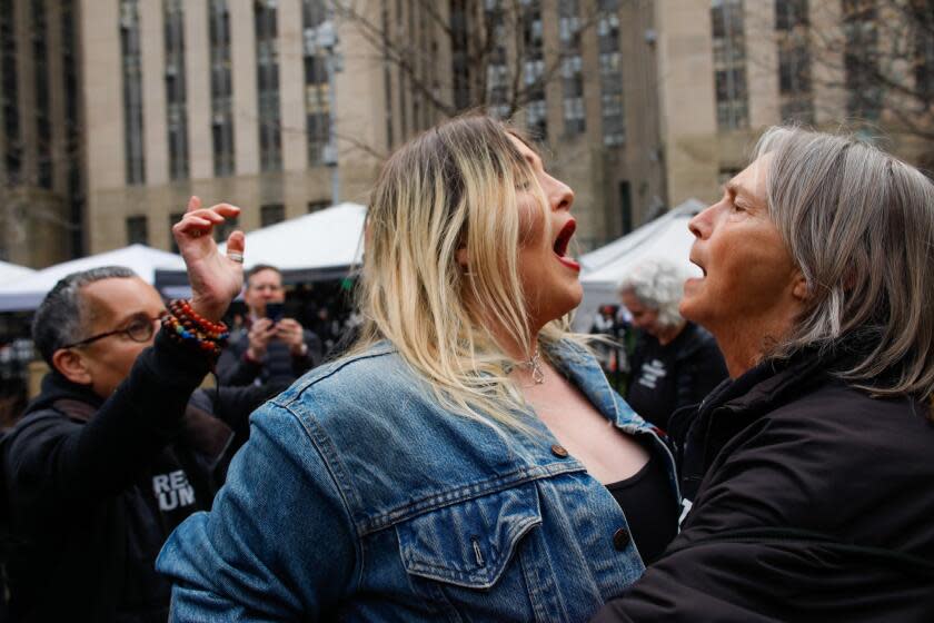 NEW YORK, NY - APRIL 04: A Trump supporter (L) argues with an Anti-Trump protester after she removed an anti-Trump banner from her outside the Manhattan Criminal Courthouse on April 04, 2023 in New York City. Former President Donald Trump is scheduled to travel to New York City today with an expected arraignment tomorrow at court following his indictment by a grand jury. The indictment is sealed but a grand jury has heard evidence of money paid to adult film actress Stormy Daniels during Trump's 2016 presidential campaign. (Photo by Kena Betancur/Getty Images)