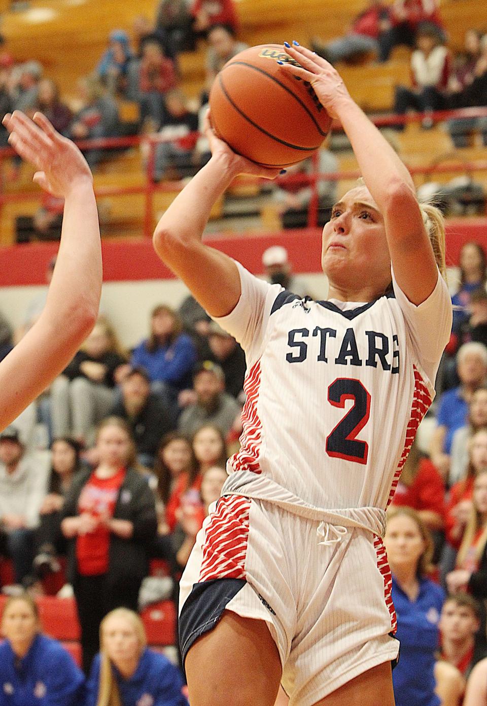 Bedford North Lawrence's Chloe Spreen (2) shoots from the baseline during the sectional final game on Tuesday, Feb. 8, 2022.