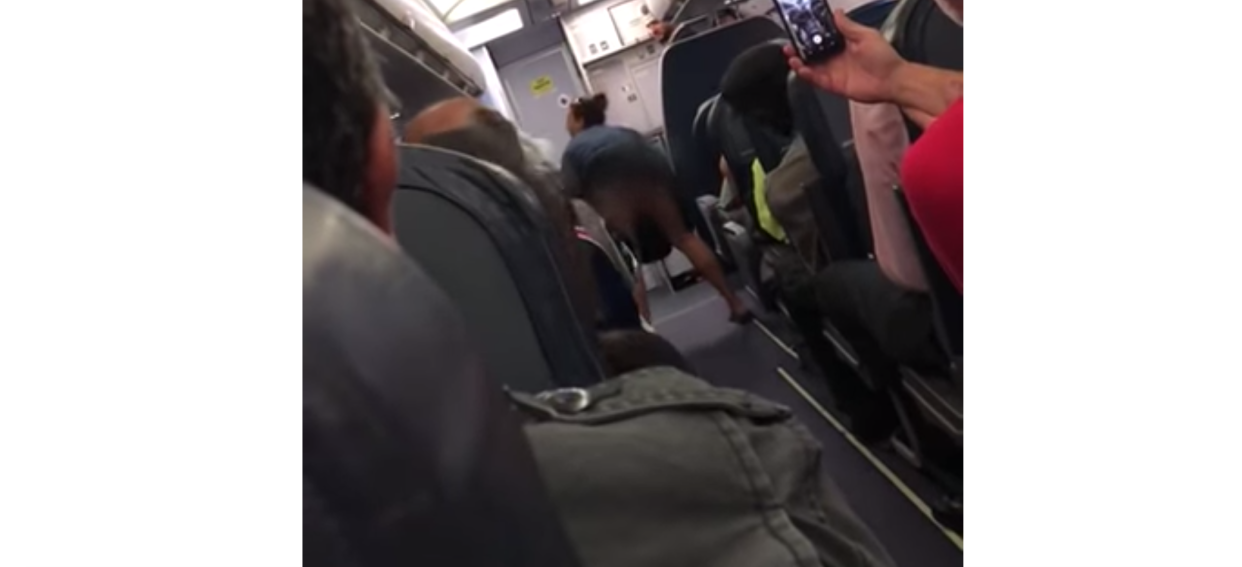 An allegedly drunk woman flashed passengers on a Spirit Airlines flight to New Jersey before she was removed from the plane. (Photo: YouTube)